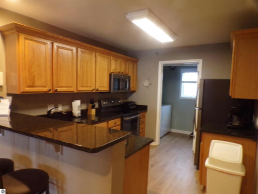 1246 SUNNYSIDE DR APT 306, CADILLAC, MI 49601, photo 2 of 19